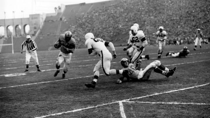 Los Angeles Rams halfback Dan Towler on a carry in a 24-17 win over the Cleveland Browns in a League Championship game on December 23, 1951 at Los Angeles Memorial Coliseum in Los Angeles, California. (Photo by Vic Stein/Getty Images) *** Local Caption ***