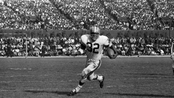 CLEVELAND, OH - OCTOBER 17, 1965: Runningback Jin Brown #32 of the Cleveland Browns runs with the ball during a game on October 17, 1965 against the Dallas Cowboys at Municipal Stadium in Cleveland, Ohio. 65-71360 (Photo by Herman Seid Collection/Diamond Images/Getty Images)