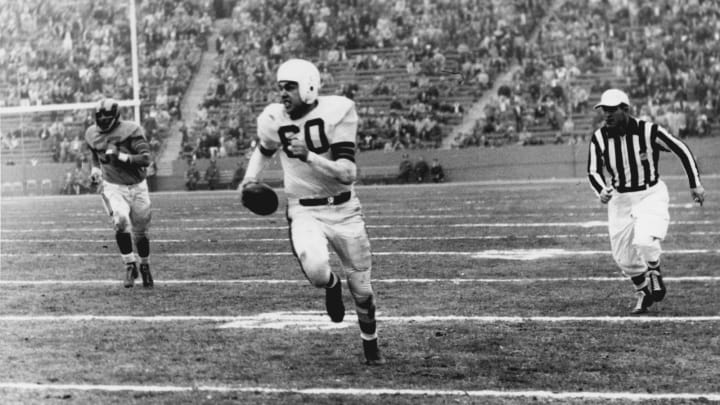 Cleveland Browns Hall of Fame quarterback Otto Graham on a run in a 24-17 loss to the Los Angeles Rams in a League Championship game on December 23, 1951 at Los Angeles Memorial Coliseum in Los Angeles, California. (Photo by Vic Stein/Getty Images) *** Local Caption ***