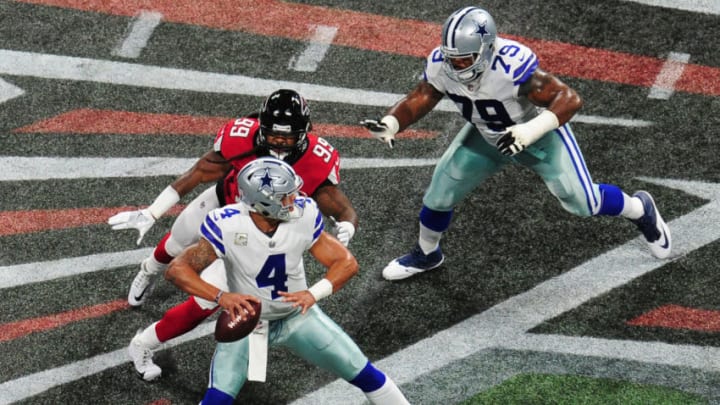 ATLANTA, GA - NOVEMBER 12: Dak Prescott #4 of the Dallas Cowboys passes despite pressure by Adrian Clayborn #99 of the Atlanta Falcons at Mercedes-Benz Stadium on November 12, 2017 in Atlanta, Georgia. (Photo by Scott Cunningham/Getty Images)