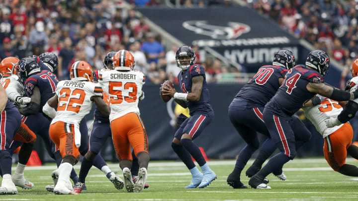 HOUSTON, TX – DECEMBER 02: Deshaun Watson #4 of the Houston Texans looks to pass under pressure by Myles Garrett #95 of the Cleveland Browns an dJoe Schobert #53 in the second half at NRG Stadium on December 2, 2018, in Houston, Texas. (Photo by Tim Warner/Getty Images)