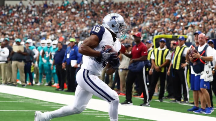 Sep 22, 2019; Arlington, TX, USA; Dallas Cowboys receiver Amari Cooper (19) runs with the ball after a reception for a first quarter touchdown against the Miami Dolphins at AT&T Stadium. Mandatory Credit: Matthew Emmons-USA TODAY Sports