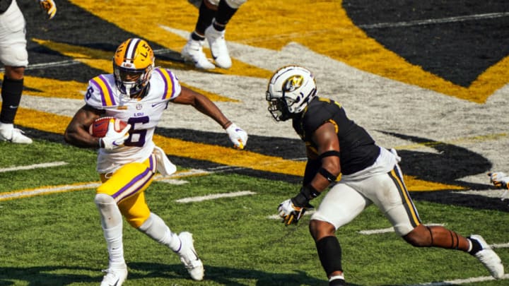 Oct 10, 2020; Columbia, Missouri, USA; LSU Tigers wide receiver Terrace Marshall Jr. (6) runs against Missouri Tigers safety Martez Manuel (3) during the second half at Faurot Field at Memorial Stadium. Mandatory Credit: Jay Biggerstaff-USA TODAY Sports