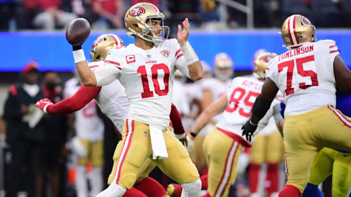 Jan 30, 2022; Inglewood, California, USA; San Francisco 49ers quarterback Jimmy Garoppolo throws a pass against the Los Angeles Rams in the first half during the NFC Championship Game at SoFi Stadium. Mandatory Credit: Gary A. Vasquez-USA TODAY Sports