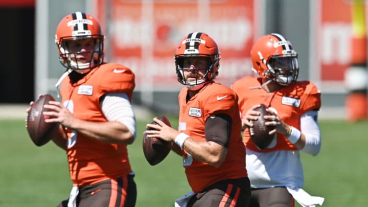 Aug 19, 2020; Berea, Ohio, USA; Cleveland Browns quarterback Case Keenum (center) works on a drill wit quarterback Garrett Gilbert (left) and quarterback Baker Mayfield (right) during training camp at the Cleveland Browns training facility. Mandatory Credit: Ken Blaze-USA TODAY Sports