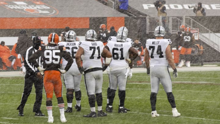 Nov 1, 2020; Cleveland, Ohio, USA; Cleveland Browns defensive end Myles Garrett (95) stands watching the Las Vegas Raiders offense between downs as snow flies during the second quarter at FirstEnergy Stadium. Mandatory Credit: Scott Galvin-USA TODAY Sports