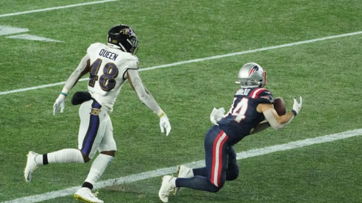 Nov 15, 2020; Foxborough, Massachusetts, USA; New England Patriots running back Rex Burkhead (34) makes the catch for a touchdown against Baltimore Ravens inside linebacker Patrick Queen (48) during the second quarter at Gillette Stadium. Mandatory Credit: David Butler II-USA TODAY Sports