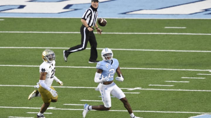 Nov 27, 2020; Chapel Hill, North Carolina, USA; North Carolina Tar Heels wide receiver Dyami Brown (2) attempts to make a catch as Notre Dame Fighting Irish cornerback TaRiq Bracy (28) defends in the second quarter at Kenan Memorial Stadium. Mandatory Credit: Bob Donnan-USA TODAY Sports