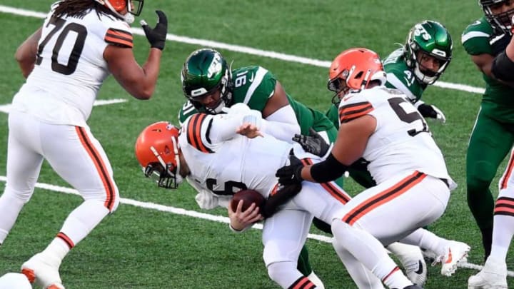New York Jets lineman John Franklin-Myers (91) sacks Cleveland Browns quarterback Baker Mayfield (6) during a game at MetLife Stadium on Sunday, Dec. 27, 2020, in East Rutherford.Nyj Vs Cle