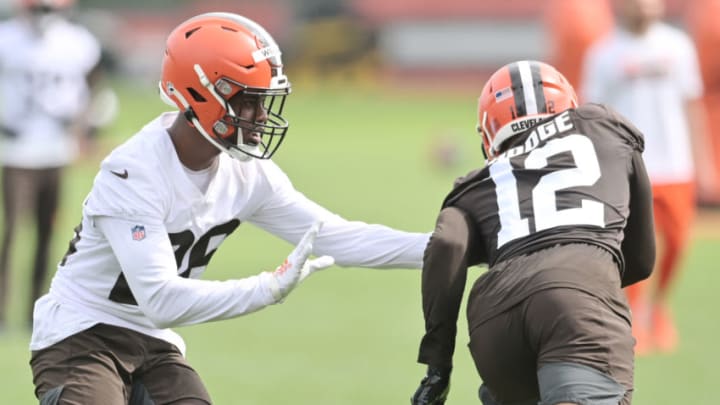 Jun 9, 2021; Berea, Ohio, USA; Cleveland Browns cornerback Greedy Williams (26) covers wide receiver KhaDarel Hodge (12) during organized team activities at the Cleveland Browns training facility. Mandatory Credit: Ken Blaze-USA TODAY Sports