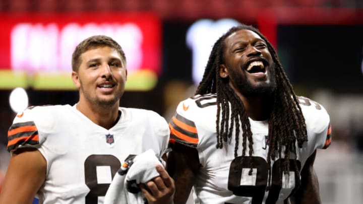 Aug 29, 2021; Atlanta, Georgia, USA; Cleveland Browns tight end Austin Hooper (81) and defensive end Jadeveon Clowney (90) reacts after their win against the Atlanta Falcons at Mercedes-Benz Stadium. Mandatory Credit: Jason Getz-USA TODAY Sports Aug 29, 2021; Atlanta, Georgia, USA; Cleveland Browns tight end Austin Hooper (81) and defensive end Jadeveon Clowney (90) reacts after their win against the Atlanta Falcons at Mercedes-Benz Stadium. Mandatory Credit: Jason Getz-USA TODAY Sports