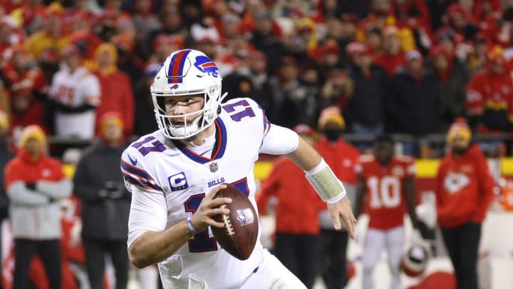 Bills quarterback Josh Allen runs around the left end.