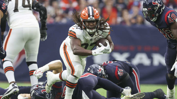 Dec 4, 2022; Houston, Texas, USA; Cleveland Browns running back Kareem Hunt (27) leaps with the ball during the fourth quarter against the Houston Texans at NRG Stadium. Mandatory Credit: Troy Taormina-USA TODAY Sports
