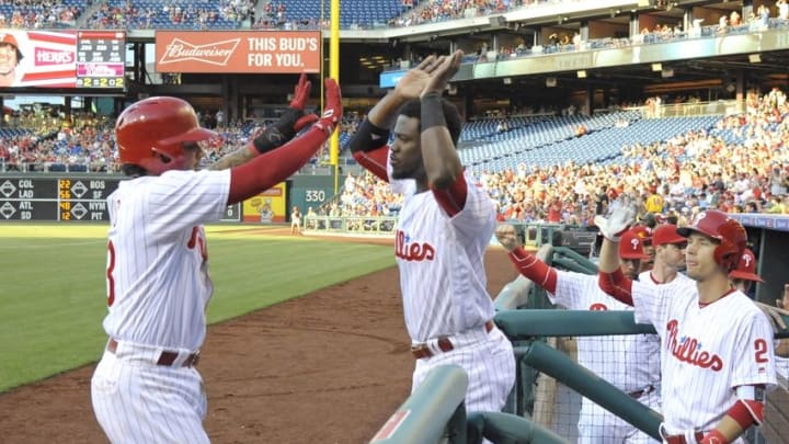 Jun 7, 2016; Philadelphia, PA, USA; Philadelphia Phillies shortstop Freddy Galvis (13) celebrates with center fielder Odubel Herrera (37) after scoring a run during the first inning against the Chicago Cubs at Citizens Bank Park. Mandatory Credit: Eric Hartline-USA TODAY Sports