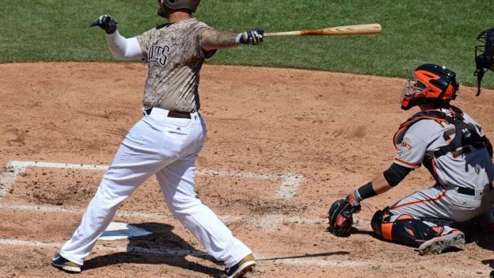 Jul 17, 2016; San Diego, CA, USA; San Diego Padres right fielder Matt Kemp (27) hits a solo home run during the fourth inning against the San Francisco Giants at Petco Park. Mandatory Credit: Jake Roth-USA TODAY Sports