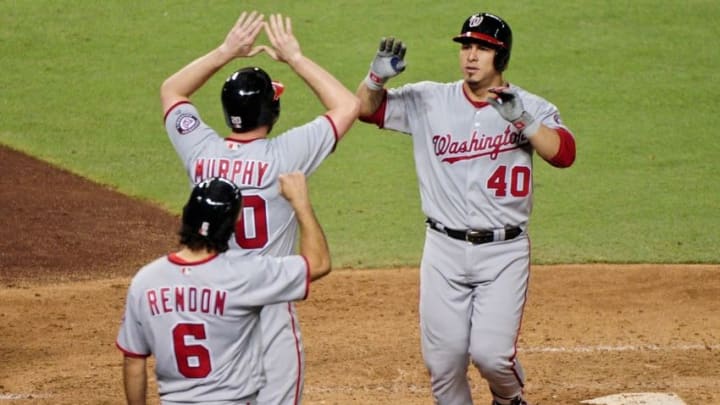 Aug 2, 2016; Phoenix, AZ, USA; Washington Nationals catcher Wilson Ramos (40) celebrates with third baseman Anthony Rendon (6) and second baseman Daniel Murphy (20) after hitting a three run home run in the fifth inning against the Arizona Diamondbacks at Chase Field. Mandatory Credit: Matt Kartozian-USA TODAY Sports