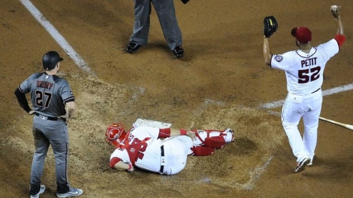 Sep 26, 2016; Washington, DC, USA; Washington Nationals catcher Wilson Ramos (40) lays on the ground after suffering an apparent right knee injury against the Arizona Diamondbacks during the sixth inning at Nationals Park. Mandatory Credit: Brad Mills-USA TODAY Sports