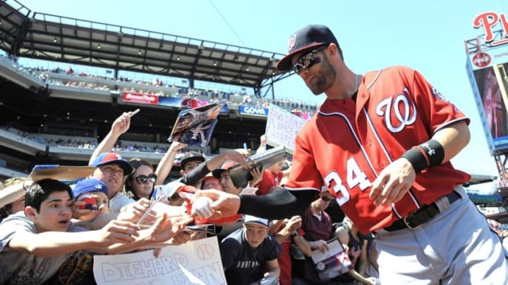 Apr 17, 2016; Philadelphia, PA, USA; Washington Nationals right fielder Bryce Harper (34) signs autographs for fans before a game against the Philadelphia Phillies at Citizens Bank Park. Mandatory Credit: Eric Hartline-USA TODAY Sports