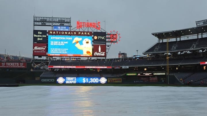 Sep 30, 2016; Washington, DC, USA; The tarp covers the field as the game between the Washington Nationals and the Miami Marlins is in a rain delay at Nationals Park. Mandatory Credit: Brad Mills-USA TODAY Sports