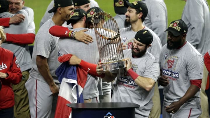 HOUSTON, TEXAS - OCTOBER 30: Adam Eaton #2 of the Washington Nationals holds the Commissioners Trophy after defeating the Houston Astros 6-2 in Game Seven to win the 2019 World Series in Game Seven of the 2019 World Series at Minute Maid Park on October 30, 2019 in Houston, Texas. (Photo by Bob Levey/Getty Images)