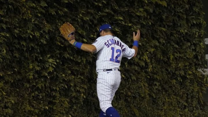 Kyle Schwarber #12 of the Chicago Cubs fails to catch a double by Max Kepler #26 of the Minnesota Twins during the seventh inning of a game at Wrigley Field on September 19, 2020 in Chicago, Illinois. (Photo by Nuccio DiNuzzo/Getty Images)