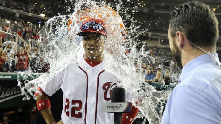 WASHINGTON, DC - MAY 21: Juan Soto #22 of the Washington Nationals is doused with water after a 10-2 victory against the San Diego Padres at Nationals Park on May 21, 2018 in Washington, DC. (Photo by Greg Fiume/Getty Images)