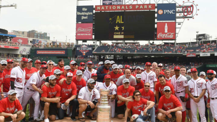 WASHINGTON, DC - JUNE 09: The Washington Nationals pose with the Washington Capitals and the Stanley Cup, as the Caps are honored before a baseball game against the San Francisco Giants at Nationals Park on June 9, 2018 in Washington, DC. (Photo by Mitchell Layton/Getty Images)