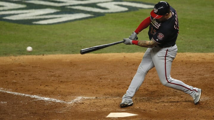 HOUSTON, TEXAS – OCTOBER 23: Asdrubal  Cabrera #13 of the Washington Nationals hits a two-run single against the Houston Astros during the seventh inning in Game Two of the 2019 World Series at Minute Maid Park on October 23, 2019 in Houston, Texas. (Photo by Bob Levey/Getty Images)