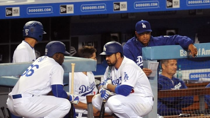 April 27, 2016; Los Angeles, CA, USA; Los Angeles Dodgers right fielder Yasiel Puig (66) speaks with first baseman Adrian Gonzalez (23) before hitting in the eighth inning against Miami Marlins at Dodger Stadium. Mandatory Credit: Gary A. Vasquez-USA TODAY Sports April 27, 2016; Los Angeles, CA, USA; Los Angeles Dodgers right fielder Yasiel Puig (66) speaks with first baseman Adrian Gonzalez (23) before hitting in the eighth inning against Miami Marlins at Dodger Stadium. Mandatory Credit: Gary A. Vasquez-USA TODAY Sports