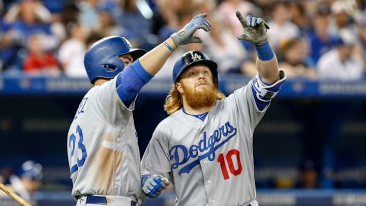 May 7, 2016; Toronto, Ontario, CAN; Los Angeles Dodgers third baseman Justin Turner (10) celebrates with first baseman Adrian Gonzalez (23) after hitting a home run against the Toronto Blue Jays in the eighth inning at Rogers Centre. Mandatory Credit: Kevin Sousa-USA TODAY Sports