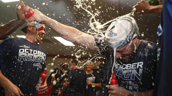 BALTIMORE, MARYLAND - SEPTEMBER 10: The Los Angeles Dodgers celebrate in the clubhouse after defeating the Baltimore Orioles and clinching the National League West Division Title at Oriole Park at Camden Yards on September 10, 2019 in Baltimore, Maryland. (Photo by Patrick Smith/Getty Images)
