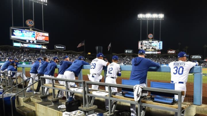 LOS ANGELES, CALIFORNIA - OCTOBER 09: The Los Angeles Dodgers look on from the dug out en route to losing to the Washington Nationals 7-3 in ten innings of game five and the National League Division Series at Dodger Stadium on October 09, 2019 in Los Angeles, California. (Photo by Harry How/Getty Images)