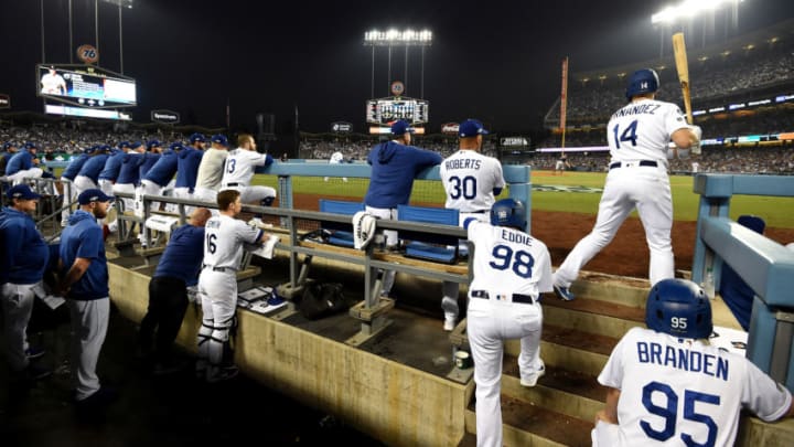 LOS ANGELES, CALIFORNIA - OCTOBER 09: Manager Dave Roberts of the Los Angeles Dodgers and Kike Hernandez #14 watch the game from dug out during game five of the National League Division Series against the Washington Nationals at Dodger Stadium on October 09, 2019 in Los Angeles, California. (Photo by Harry How/Getty Images)