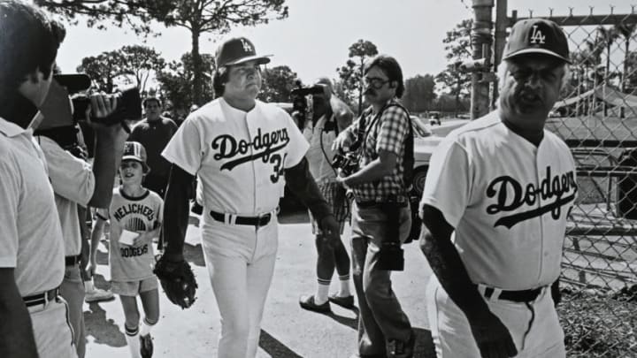 VERO BEACH, FL - FEBRUARY 15, 1981: Manager Tommy Lasorda #2 clears the way for pitcher Fernando Valenzuela #34 of the Los Angeles Dodgers during spring training at Dodgertown in Vero Beach, Florida. (Photo by Jayne Kamin-Oncea/Getty Images)