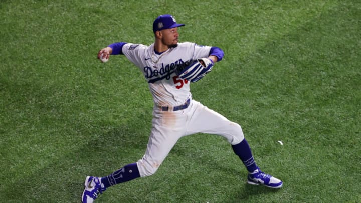 ARLINGTON, TEXAS - OCTOBER 21: Mookie Betts #50 of the Los Angeles Dodgers fields a hit against the Tampa Bay Rays during the seventh inning in Game Two of the 2020 MLB World Series at Globe Life Field on October 21, 2020 in Arlington, Texas. (Photo by Ronald Martinez/Getty Images)