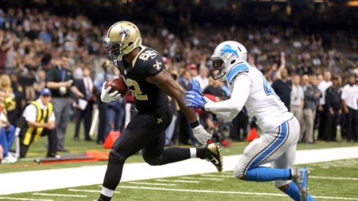 Dec 21, 2015; New Orleans, LA, USA; New Orleans Saints tight end Benjamin Watson (82) scores a touchdown on a one-yard catch while defended by Detroit Lions strong safety Isa Abdul-Quddus (42) in the fourth quarter of the game at the Mercedes-Benz Superdome. Mandatory Credit: Chuck Cook-USA TODAY Sports