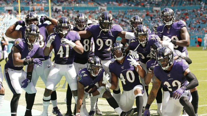 MIAMI, FLORIDA – SEPTEMBER 08: The Baltimore Ravens defense celebrates after a interception by Marlon Humphrey #44 against the Miami Dolphins during the fourth quarter at Hard Rock Stadium on September 08, 2019 in Miami, Florida. (Photo by Michael Reaves/Getty Images)