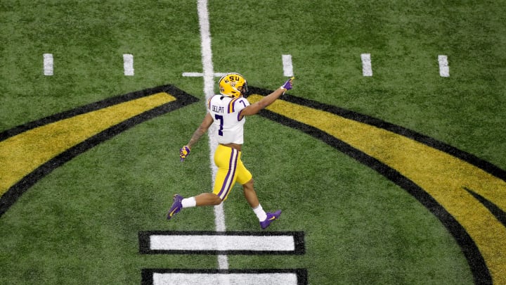NEW ORLEANS, LOUISIANA – JANUARY 13: Grant Delpit #7 of the LSU Tigers celebrates after his team scores a touchdown during the first quarter against the Clemson Tigers in the College Football Playoff National Championship game at Mercedes Benz Superdome on January 13, 2020 in New Orleans, Louisiana. (Photo by Sean Gardner/Getty Images)