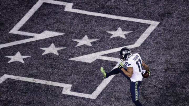 EAST RUTHERFORD, NJ - FEBRUARY 02: Wide receiver Percy Harvin #11 of the Seattle Seahawks runs for 30 yards during Super Bowl XLVIII at MetLife Stadium against the Denver Broncos on February 2, 2014 in East Rutherford, New Jersey. (Photo by Win McNamee/Getty Images)