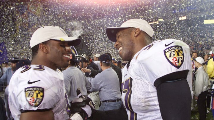 28 Jan 2001: Priest Holmes #33 and O.J. Brigance of the Baltimore Ravens celebrate after defeating the New York Giants 34-7 in Super Bowl XXXV at Raymond James Stadium in Tampa, Florida. DIGITAL IMAGE. Mandatory Credit: Tom Hauck/ALLSPORT