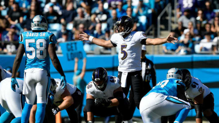 CHARLOTTE, NC - OCTOBER 28: Joe Flacco #5 of the Baltimore Ravens makes a call at the line against the Carolina Panthers in the first quarter during their game at Bank of America Stadium on October 28, 2018 in Charlotte, North Carolina. (Photo by Grant Halverson/Getty Images)