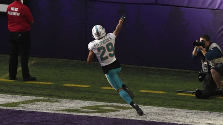 MINNEAPOLIS, MN - DECEMBER 16: Minkah Fitzpatrick #29 of the Miami Dolphins celebrates scoring a touchdown after intercepting a pass by Kirk Cousins #8 of the Minnesota Vikings in the second quarter of the game at U.S. Bank Stadium on December 16, 2018 in Minneapolis, Minnesota. Fitzpatrick scored a 50 yard touchdown on the play. (Photo by Hannah Foslien/Getty Images)