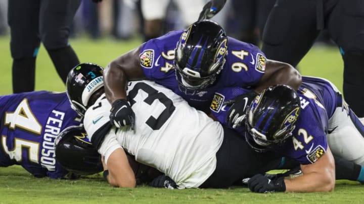 BALTIMORE, MD - AUGUST 08: Tanner Lee #3 of the Jacksonville Jaguars is sacked by Patrick Ricard #42 of the Baltimore Ravens during the second half of a preseason game at M&T Bank Stadium on August 08, 2019 in Baltimore, Maryland. (Photo by Scott Taetsch/Getty Images)