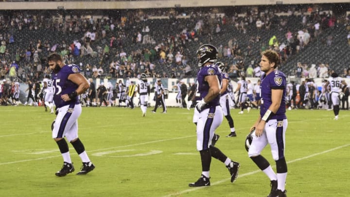 PHILADELPHIA, PA - AUGUST 22: Patrick Mekari #65, Marcus Applefield #62, and Joe Callahan #2 of the Baltimore Ravens walk off the field after play was suspended in the fourth quarter due to severe weather during a preseason game against the Philadelphia Eagles at Lincoln Financial Field on August 22, 2019 in Philadelphia, Pennsylvania. (Photo by Patrick McDermott/Getty Images)