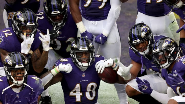 BALTIMORE, MARYLAND - OCTOBER 11: Inside linebacker Patrick Queen #48 of the Baltimore Ravens celebrates after returning a fumble for a fourth quarter touchdown against the Cincinnati Bengals at M&T Bank Stadium on October 11, 2020 in Baltimore, Maryland. (Photo by Rob Carr/Getty Images)