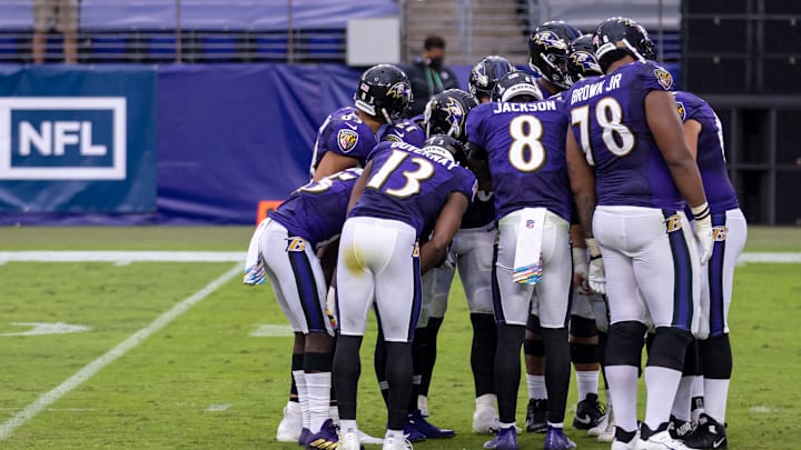 BALTIMORE, MD – OCTOBER 11: Lamar Jackson #8 of the Baltimore Ravens leads an offensive huddle during the second half of the game against the Cincinnati Bengals at M&T Bank Stadium on October 11, 2020, in Baltimore, Maryland. (Photo by Scott Taetsch/Getty Images)