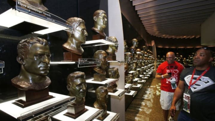 CANTON, OH - AUGUST 9: Fans look at the busts of previous inductees in the Pro Football Hall of Fame prior to the NFL Hall of Fame Game between the Pittsburgh Steelers and Minnesota Vikings at Tom Benson Hall of Fame Stadium on August 9, 2015 in Canton, Ohio. (Photo by Joe Robbins/Getty Images)
