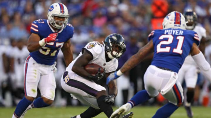 BALTIMORE, MD – AUGUST 26: Running back Taquan Mizzell #33 of the Baltimore Ravens rushes in front of free safety Jordan Poyer #21 of the Buffalo Bills in the first half during a preseason game at M&T Bank Stadium on August 26, 2017 in Baltimore, Maryland. (Photo by Patrick Smith/Getty Images)