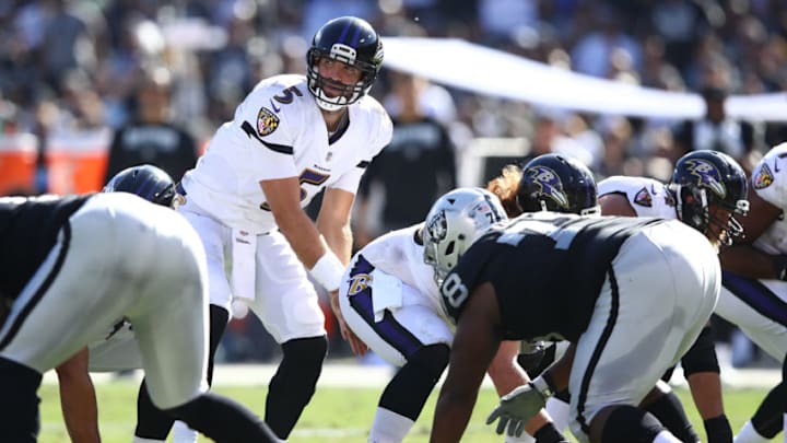 OAKLAND, CA - OCTOBER 08: Joe Flacco #5 of the Baltimore Ravens goes under center against the Oakland Raiders during their NFL game at Oakland-Alameda County Coliseum on October 8, 2017 in Oakland, California. (Photo by Ezra Shaw/Getty Images)