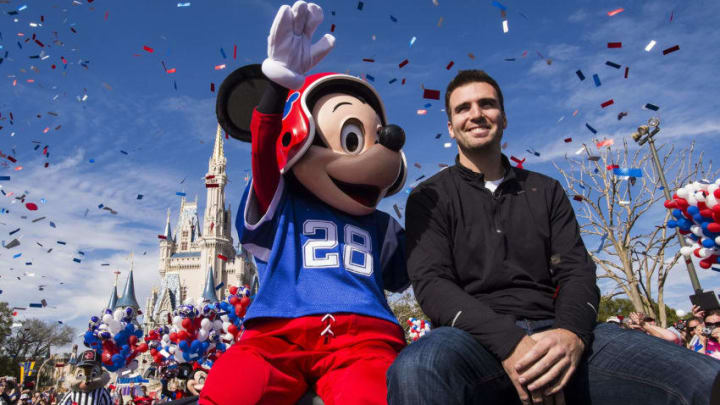 LAKE BUENA VISTA, FL - FEBRUARY 04: In this handout photo provided by Disney Parks, Super Bowl XLVII MVP Joe Flacco rides with Mickey Mouse in a parade through the Magic Kingdom at Walt Disney World Resort February 4, 2013 in Lake Buena Vista, Florida. Flacco led his Baltimore Ravens to a 34-31 win over the San Francisco 49ers last night in New Orleans. After the game, Flacco starred in a commercial where he proclaimed 'I'm Going to Disney World!' (Photo by Matt Stroshane/Disney Parks via Getty Images)